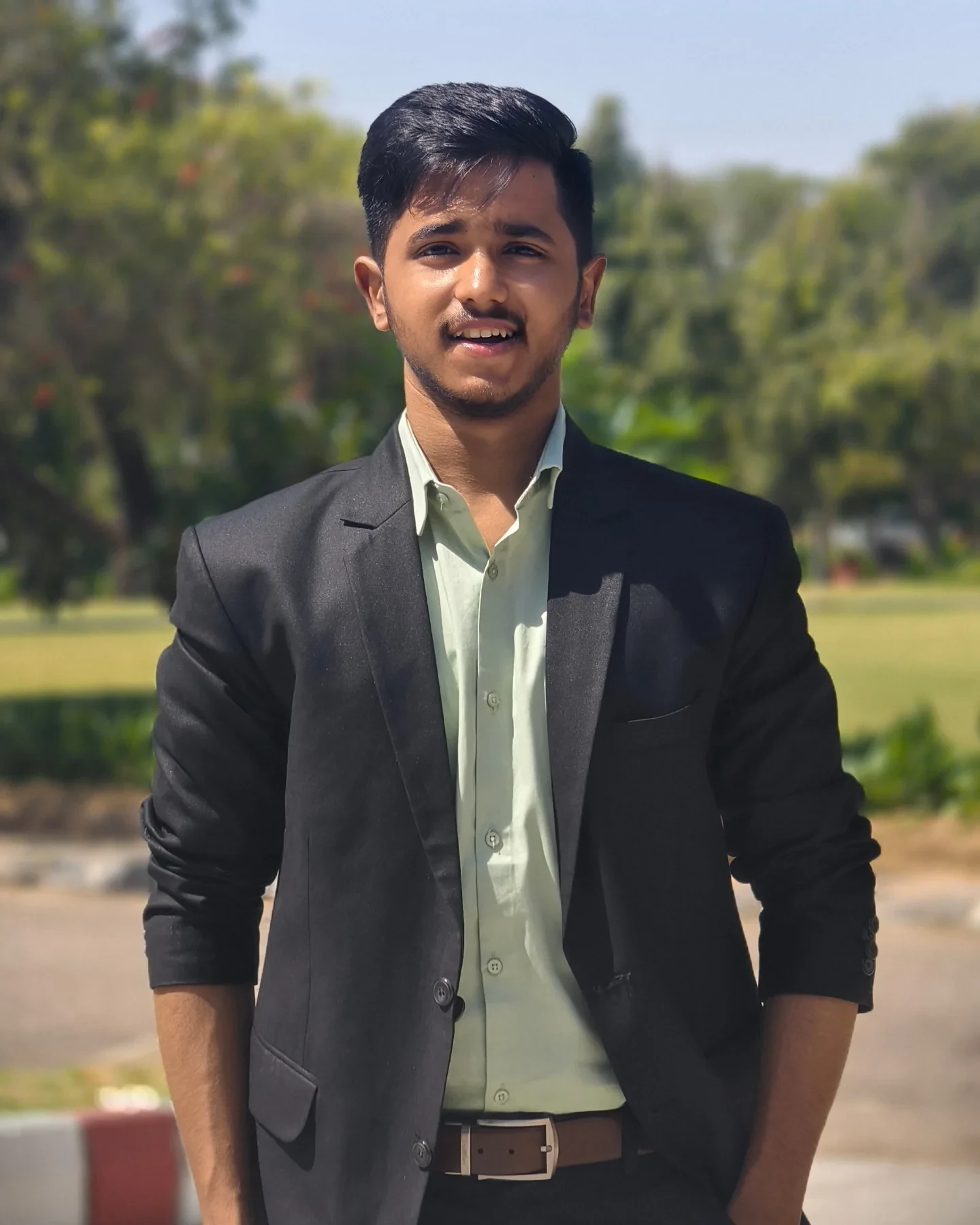 Harsh Rajput in a black blazer, from his Jaipur chapter